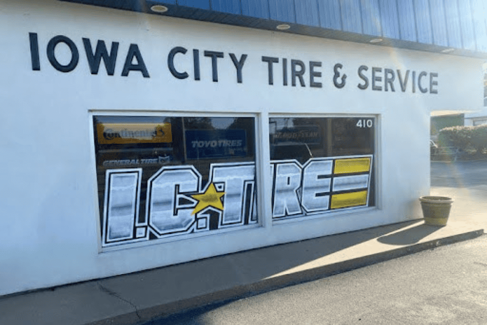 Find the best auto repair shop near me in Iowa City, IA with Iowa City Tire & Service. Image of front window of I.C. Tire shop.