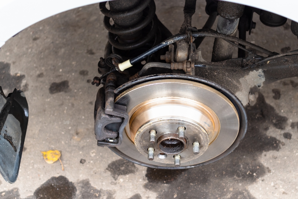 End-of-Winter Vehicle Service, Brake Repair in Iowa City IA At Iowa City Tire and Service. Close-up of a vehicle brake system