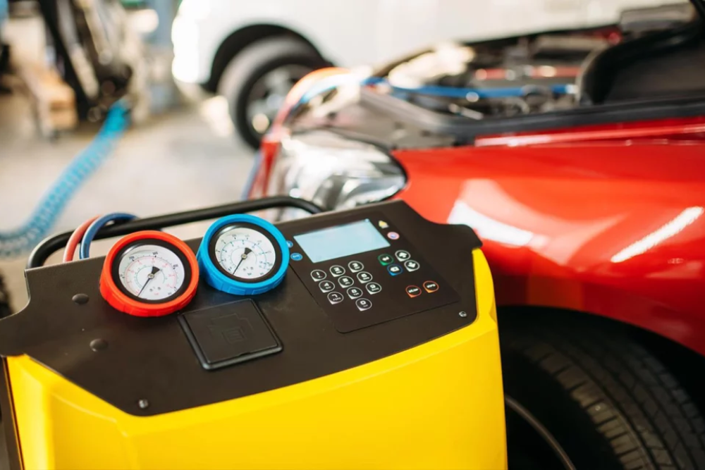 A:C Repair in Iowa City IA At Iowa City Tire and Service. Close-up view of R1234yf automotive A/C service machine
